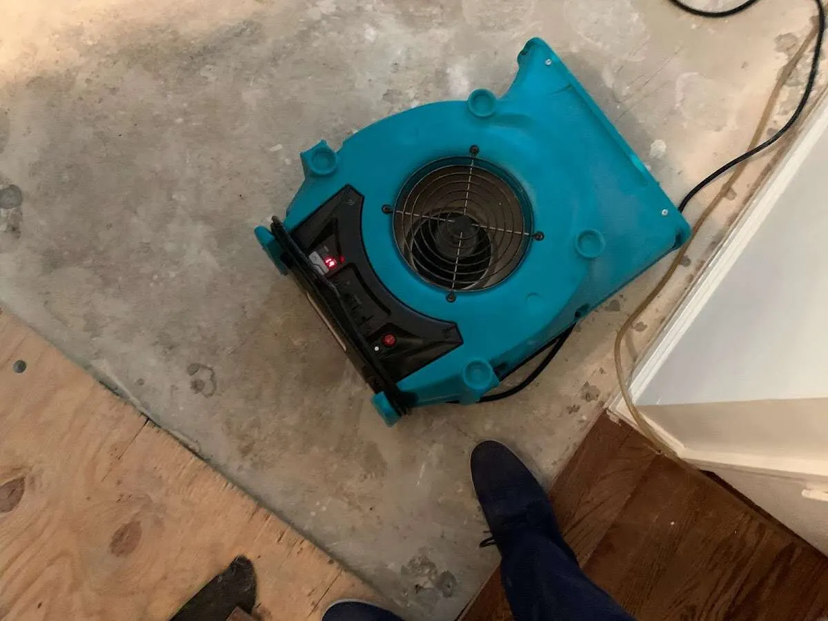 Air mover drying subfloor during Commercial Water Damage Restoration in Highland Heights